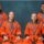 Artemis 3 astronauts Andre Douglas, Luca Parmitano, Randy Bresnik and Frank Rubio posing in orange NASA flight suits, Johnson Space Center, June 2026