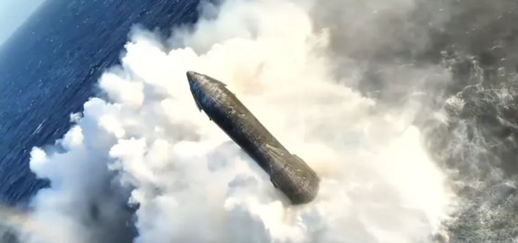 Splash A top-down aerial drone view of SpaceX's Starship upper stage floating intact in the middle of the dark blue ocean, surrounded by a large ring of white foam and steam generated during its soft splashdown.